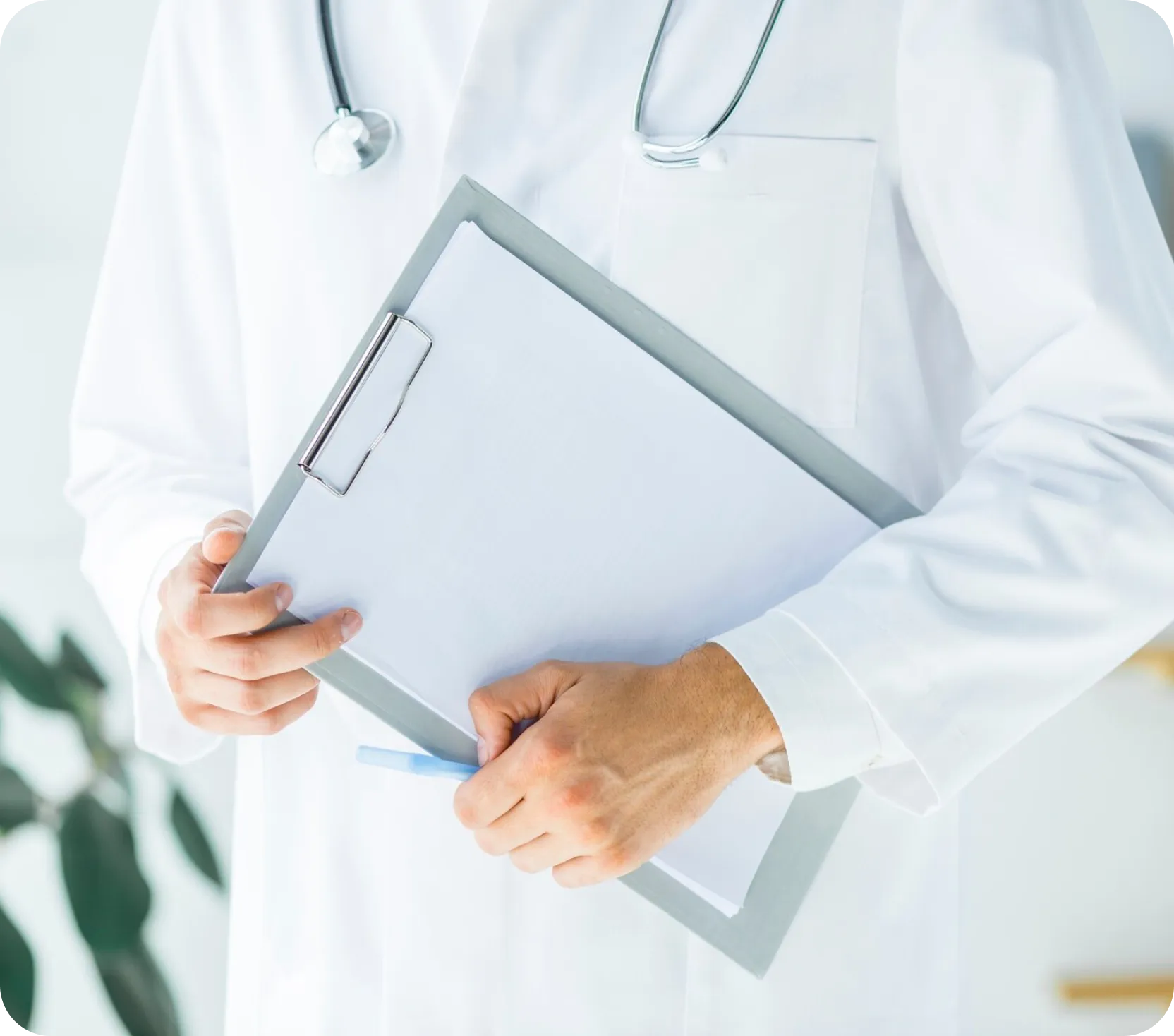 A provider, equipped with a clipboard and pen, is poised to record vital information during a patient consultation.